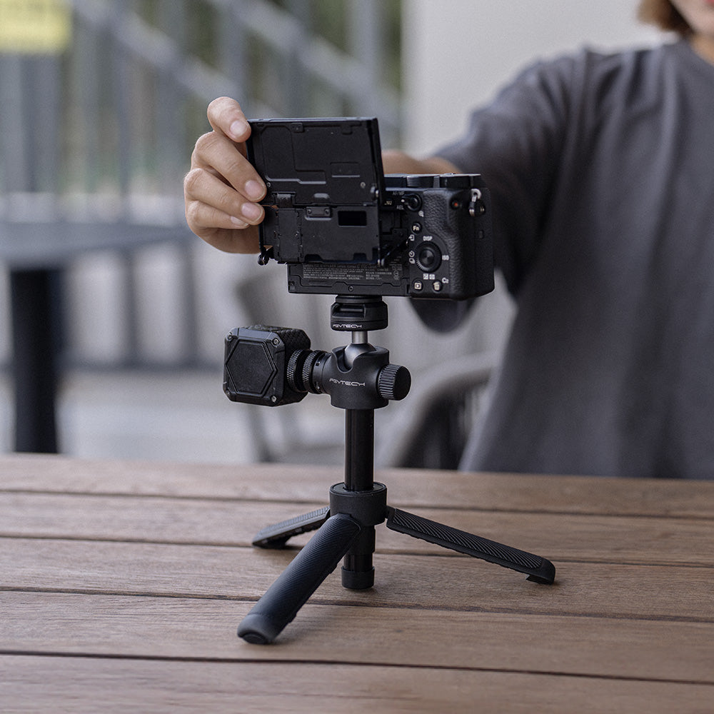 The CapLock Action Camera Extension Pole Tripod could help your camera stand on the desk.
