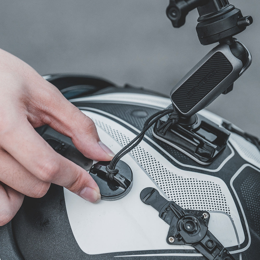 The CapLock Action Camera Helmet Mount​ utilizes a robust attachment mechanism for a safe and steady connection; simply fix the safety base to your helmet's side to reliably connect your camera gear to the integrated safety lanyard.
