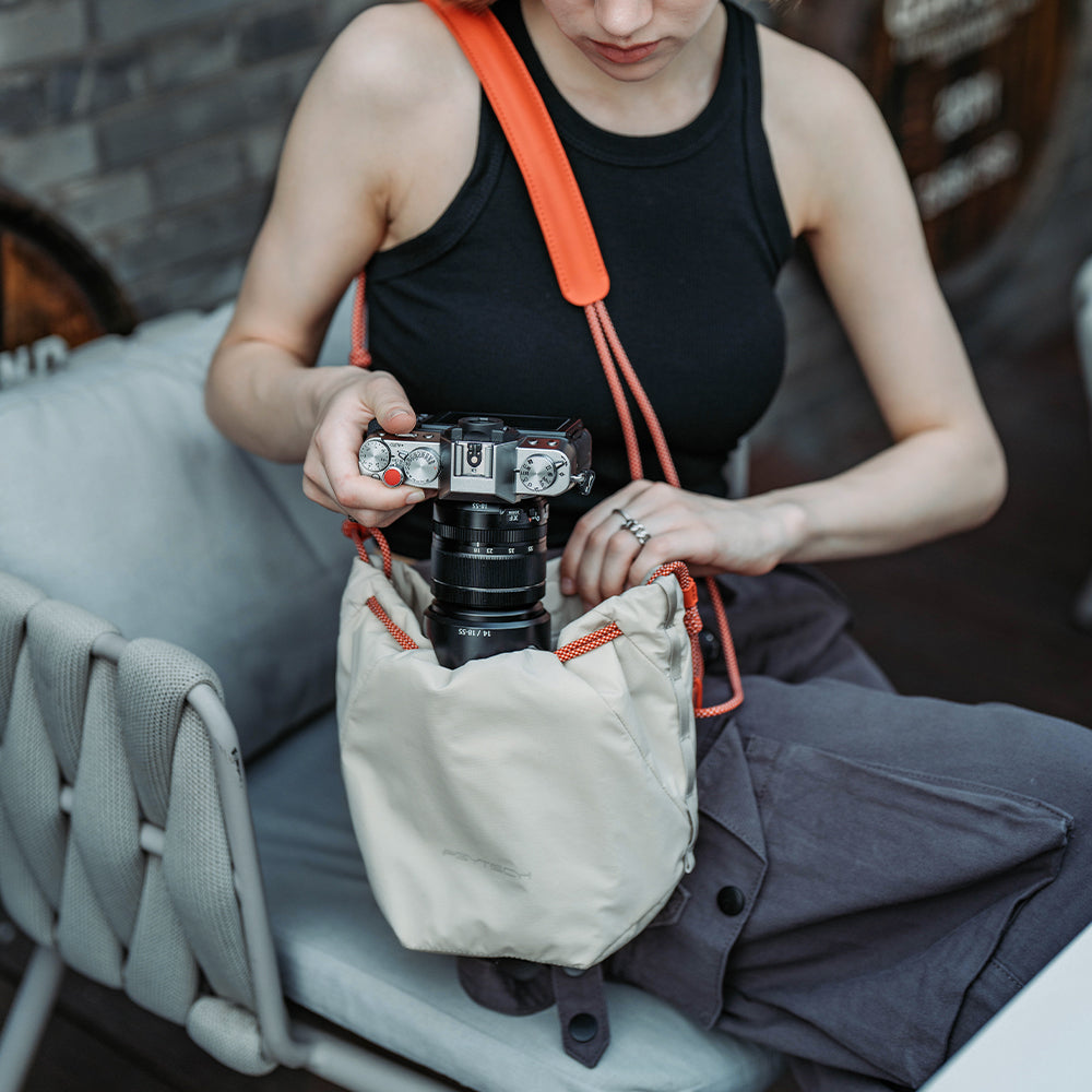 Use OneGo Drawstring Bag to carry your camera safely.