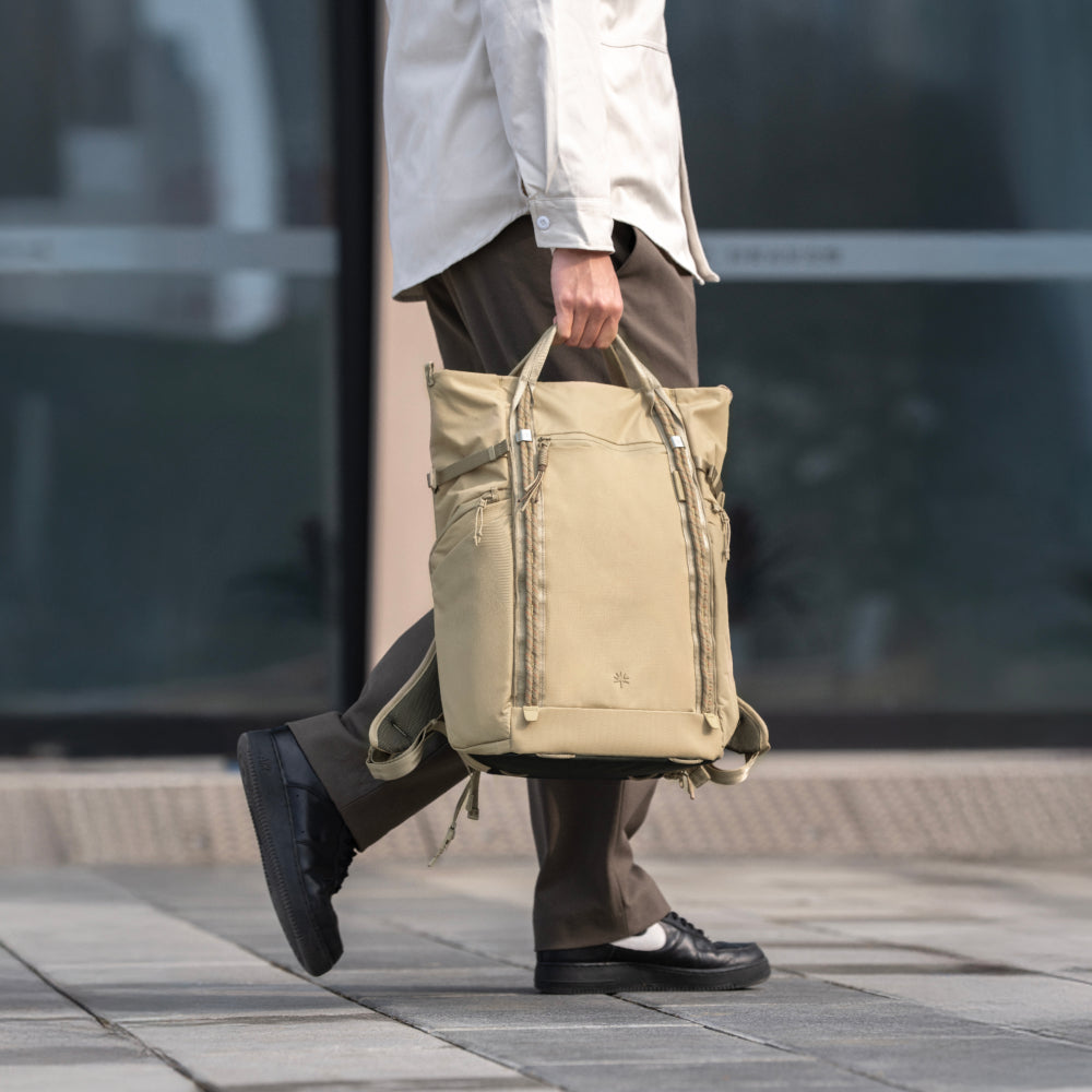 Carry it by hand for a sleek, polished look, ideal for casual days or quick trips.