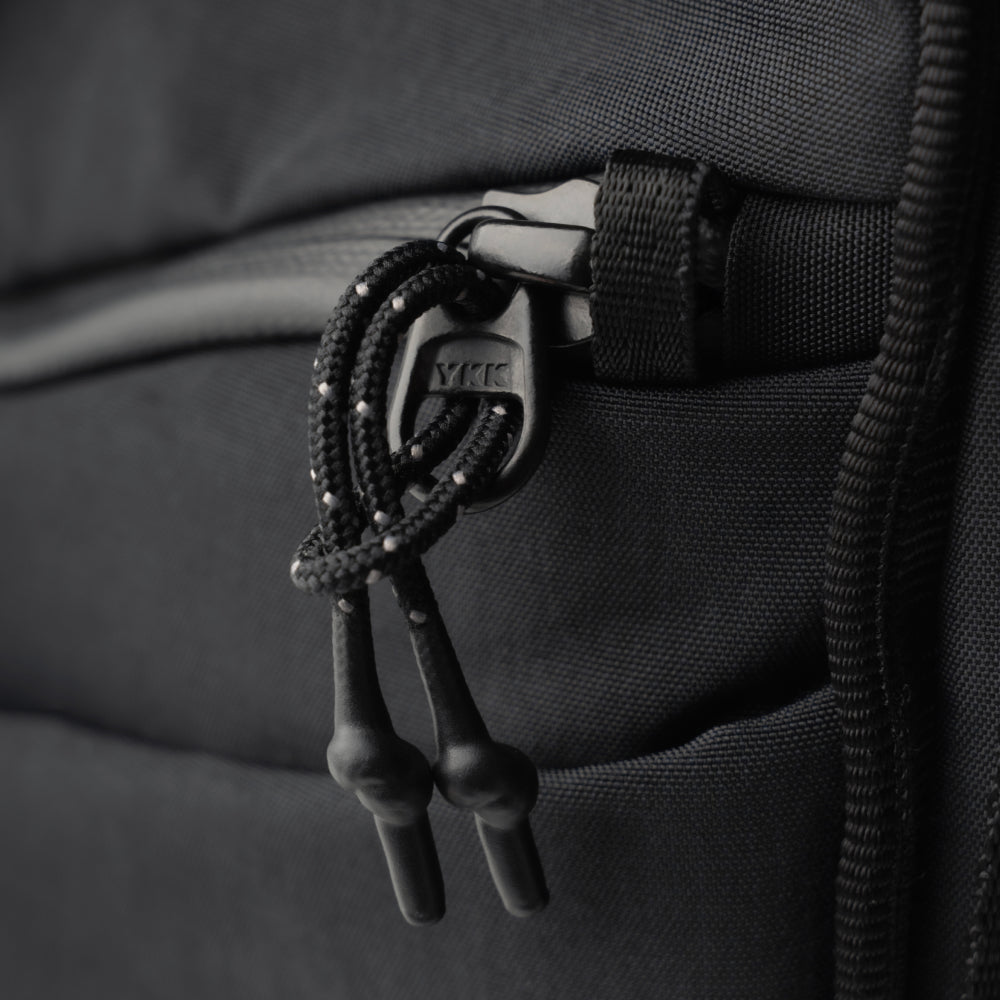 Full-cover YKK water-resistant zippers + anti-theft zipper loop for double security protection.