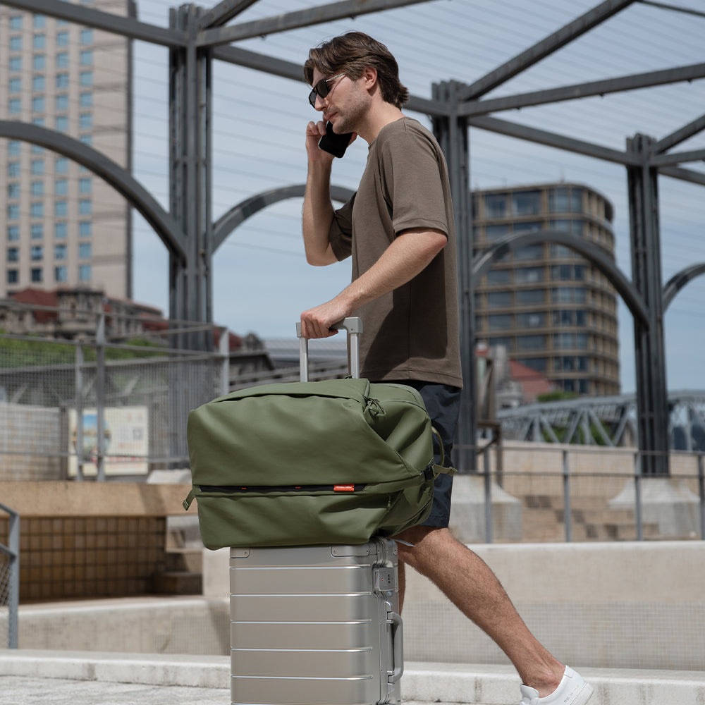 The OneMo Travel Backpack featured with back panel strap to secure to your luggage.