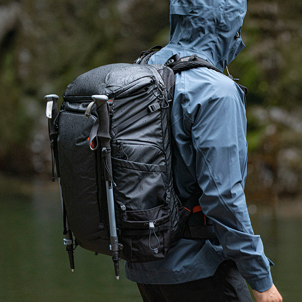 Explore the Outdoors using the OnePro Flex Backpack in the rain.