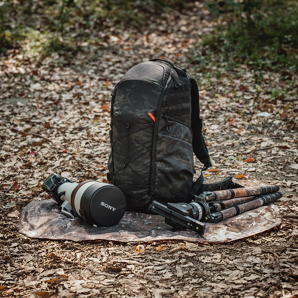OnePro ST Backpack: 2-in-1 rain cover, unfolds into a moisture-resistant mat for clean outdoor gear access.