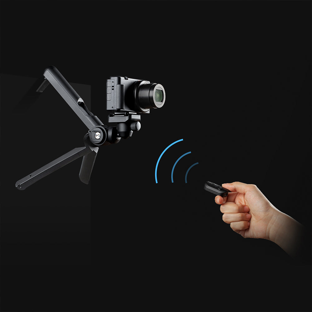 A wireless remote control is used separately from the MantisPod 2.0 tripod to operate a camera mounted on a flexible arm for versatile shooting.