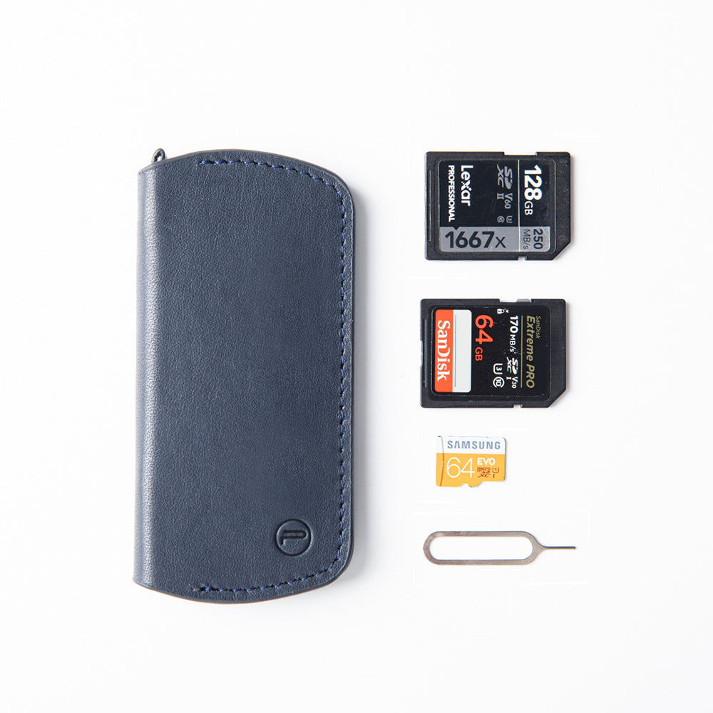 memory-card-wallet-deep-navy-can hold 3 SD cards, 1 quick release wrench, 3 SIM/ TF (micro SD) cards and 1 SIM card tray pin.